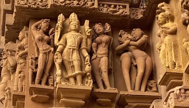 Fine stone carvings on a Khajuraho temple wall