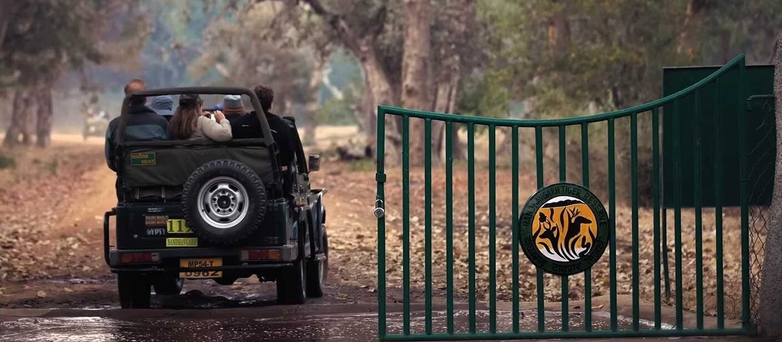 A safari jeep with visitors enters the gate of Bandhavgarh Tiger Reserve